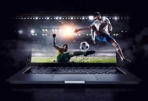 mecz piłki nożnej na ekranie laptopa